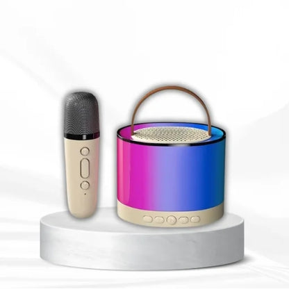 WhirlBD K52 Karaoke Machine with wireless microphone and Bluetooth speaker, featuring colorful LED lights and control panel.