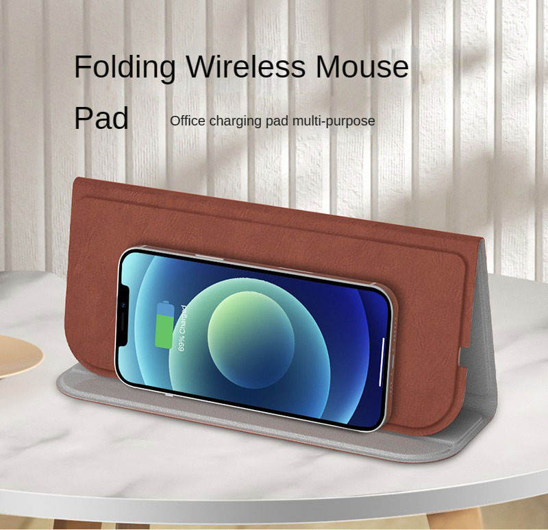 WhirlBD 15W wireless charger mouse pad with built-in phone stand on smooth surface, ideal for desk organization and charging.
