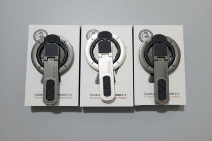 WhirlBD double-sided magnetic phone holder mounted on a car dashboard, holding a smartphone securely for hands-free use.